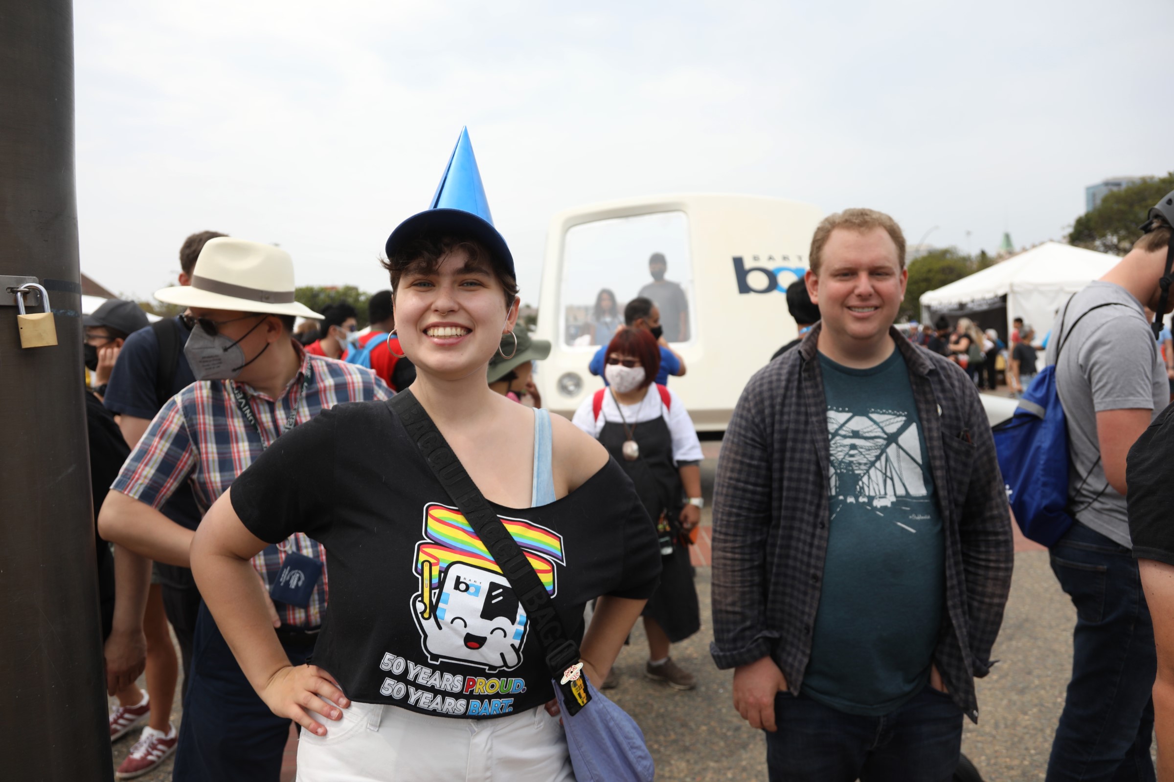 People pose with the train car nose at BART’s 50th Anniversary Celebration and Family Fun Festival on Sept. 10, 2022.