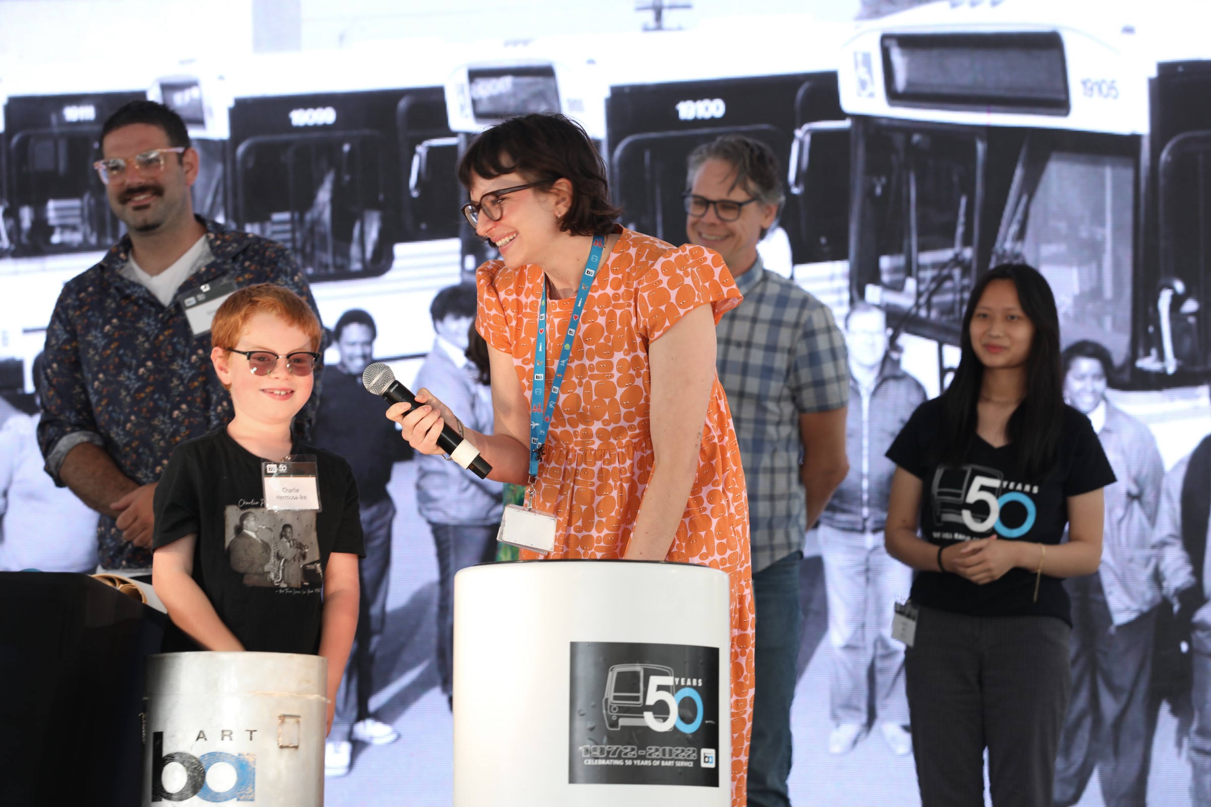 BART fan Charlie pulls an item from the 1992 time capsule onstage during BART’s 50th Anniversary Celebration and Family Fun Festival.