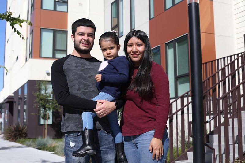 The Barragan family photographed outside their home at Coliseum Connections