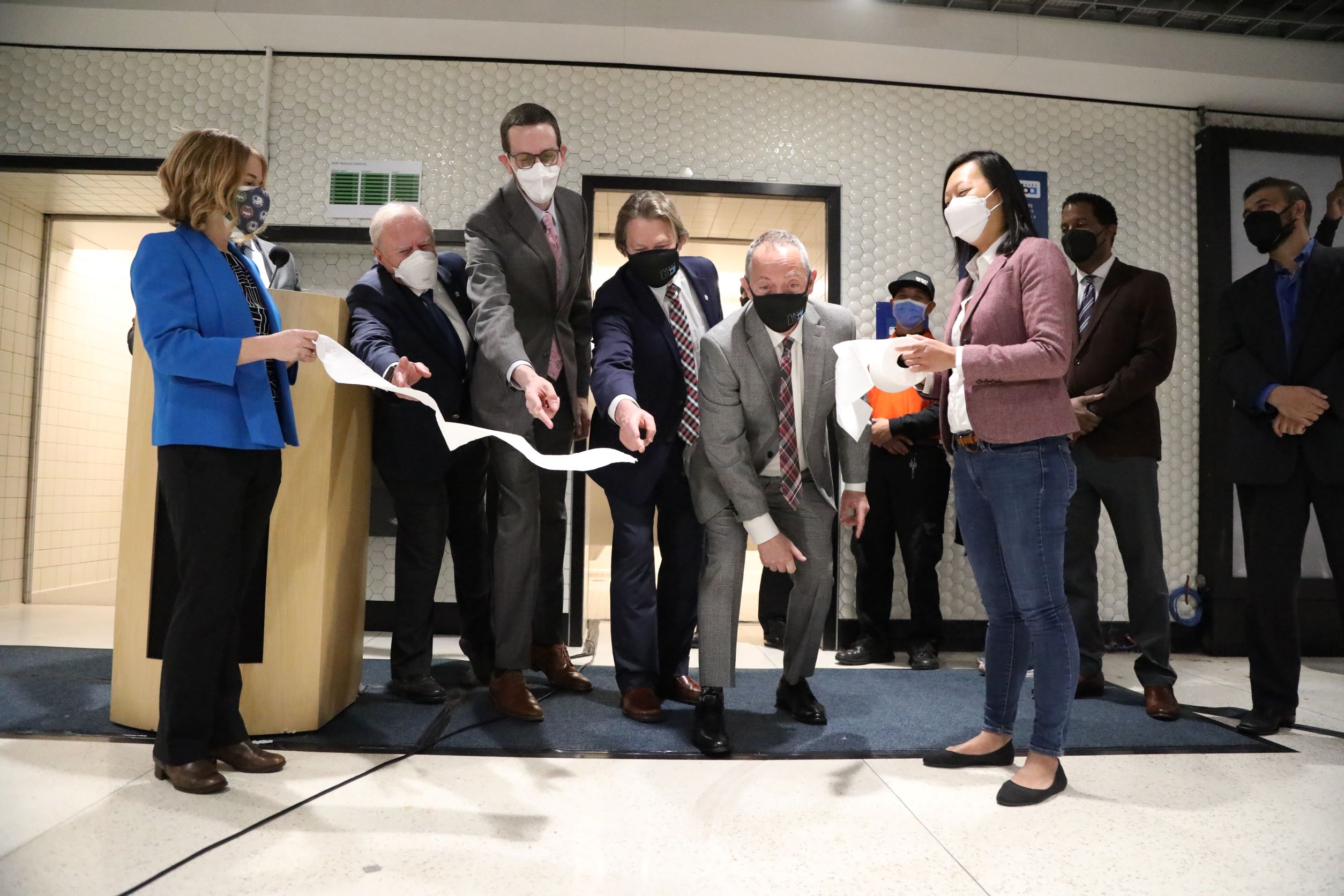 Powell station restroom toilet paper cutting ceremony