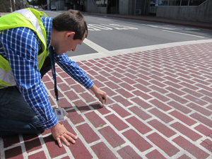 Aron Rice measures a crosswalk