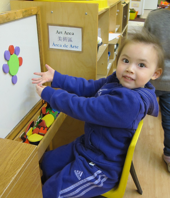 Lilah shows off her art work