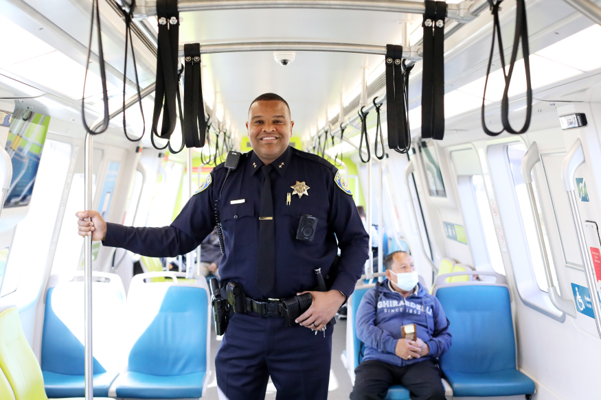 Deputy Chief Ja'Son Scott poses on a Fleet of the Future train