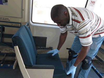 Worker changes out a seat