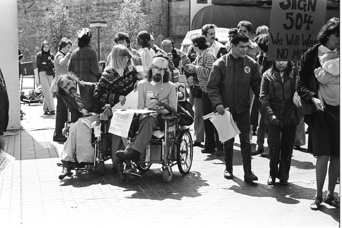 Hale Zukas at sit-in protest, at center with helmet, photo by Anthony Tusler / courtesy of CIL