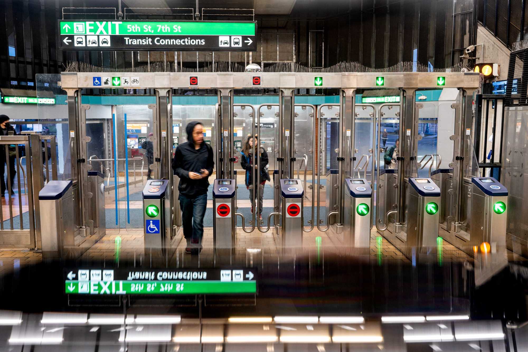 Person walking through the new fare gates