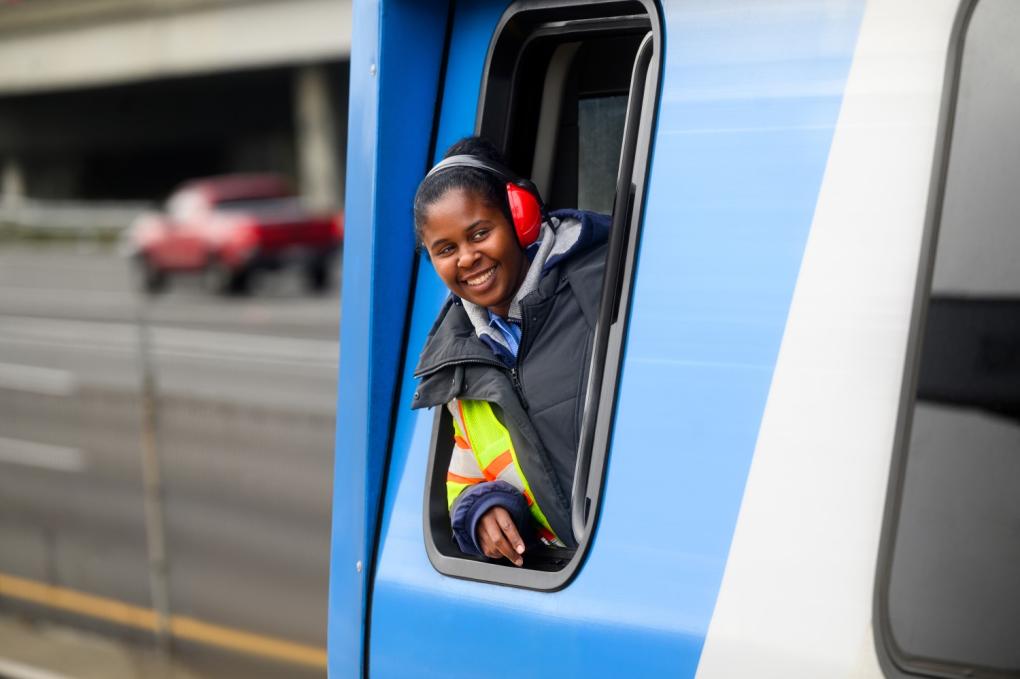 Train operator in a cab window