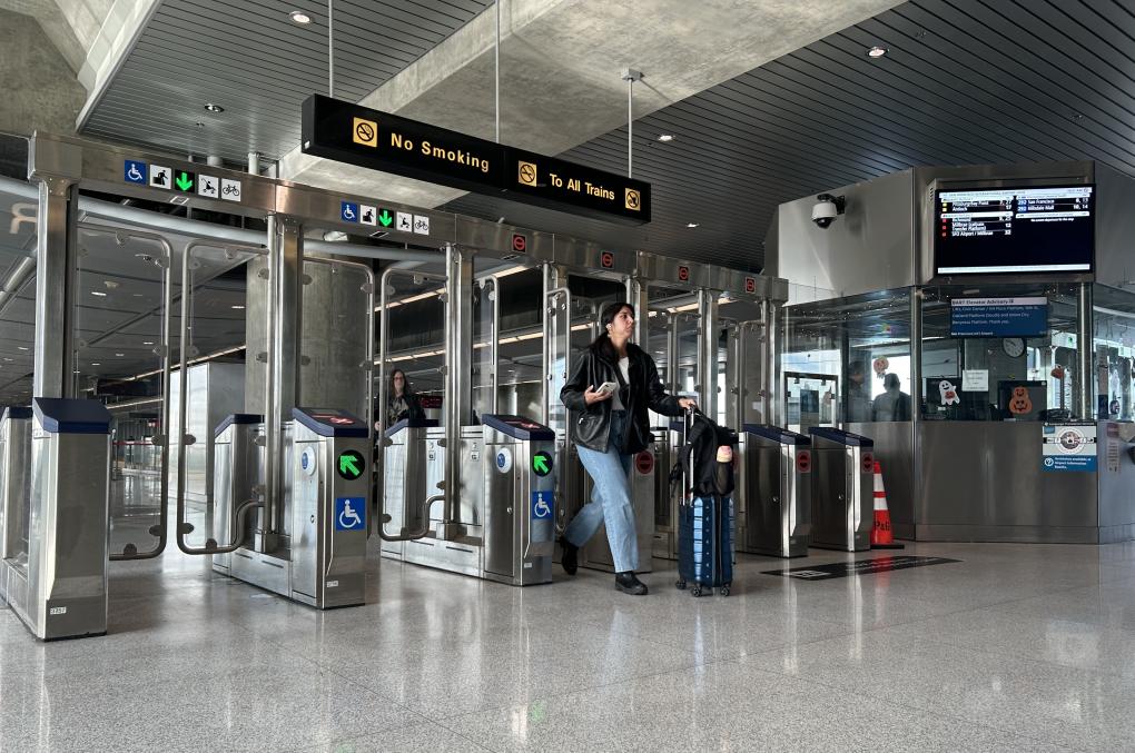 Person walks through fare gates