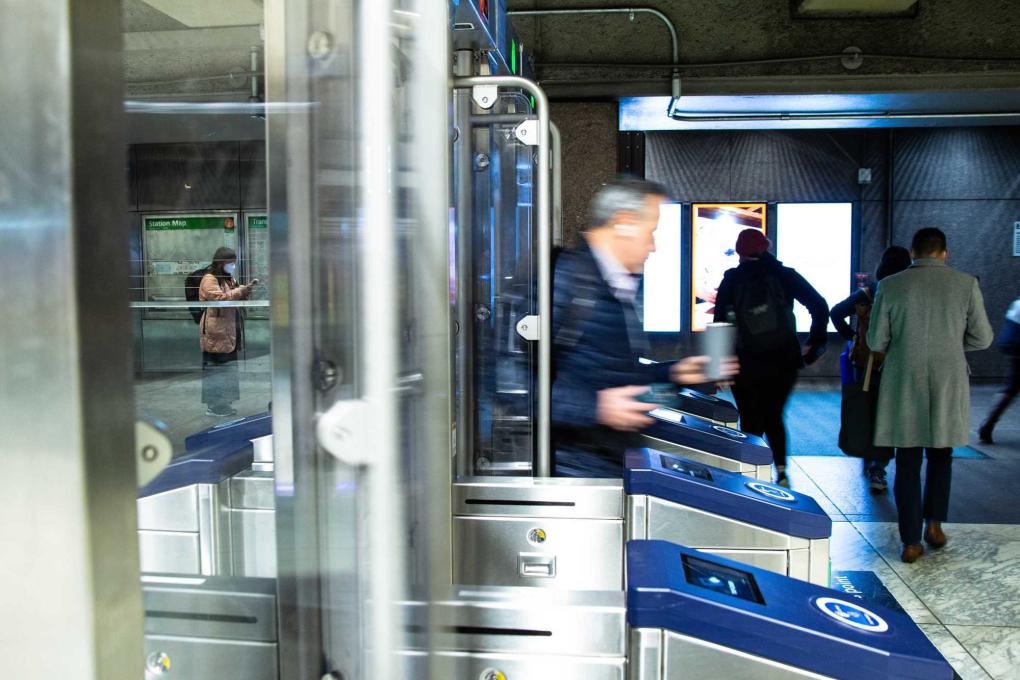 People walking through the next generation fare gates