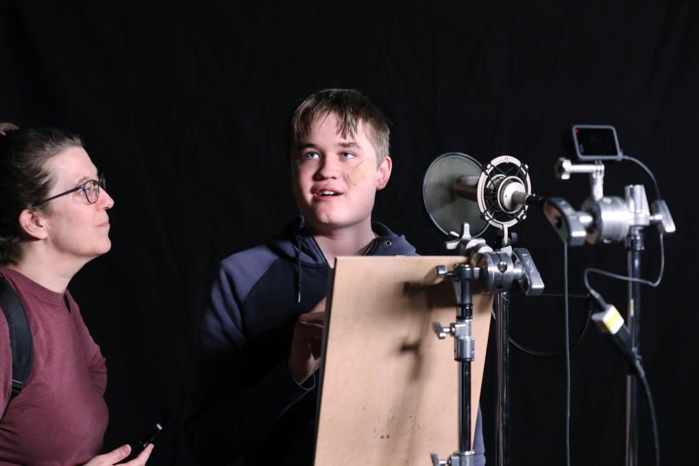 Participants in the Autism Transit Project record station announcements at BART Headquarters.