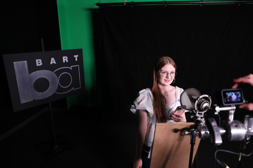 Participants in the Autism Transit Project record station announcements at BART Headquarters.